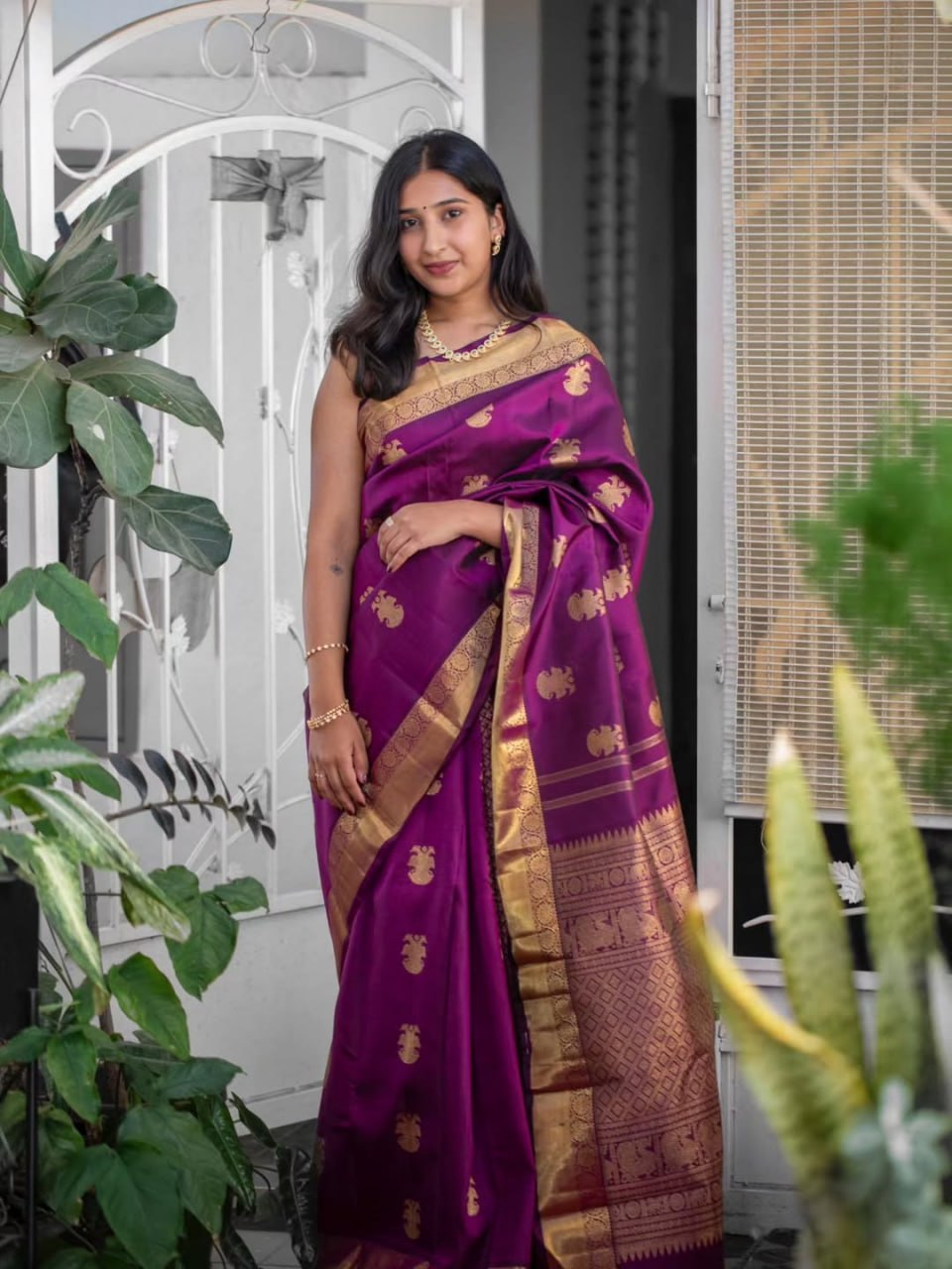 Purple Saree with Golden Peacock Motifs
